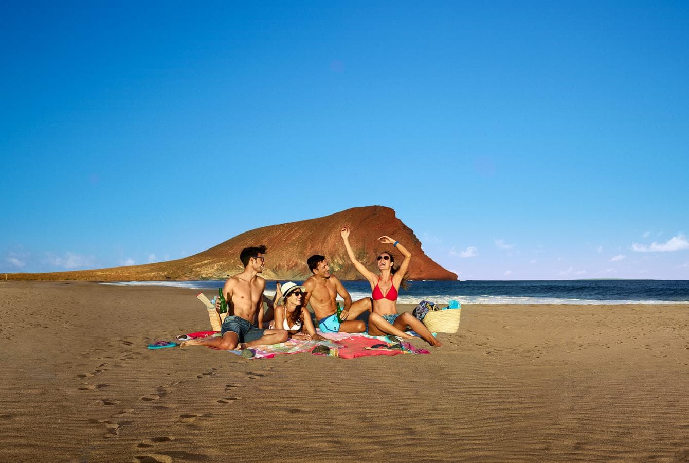 Group of young people having fun at La Tejita beach